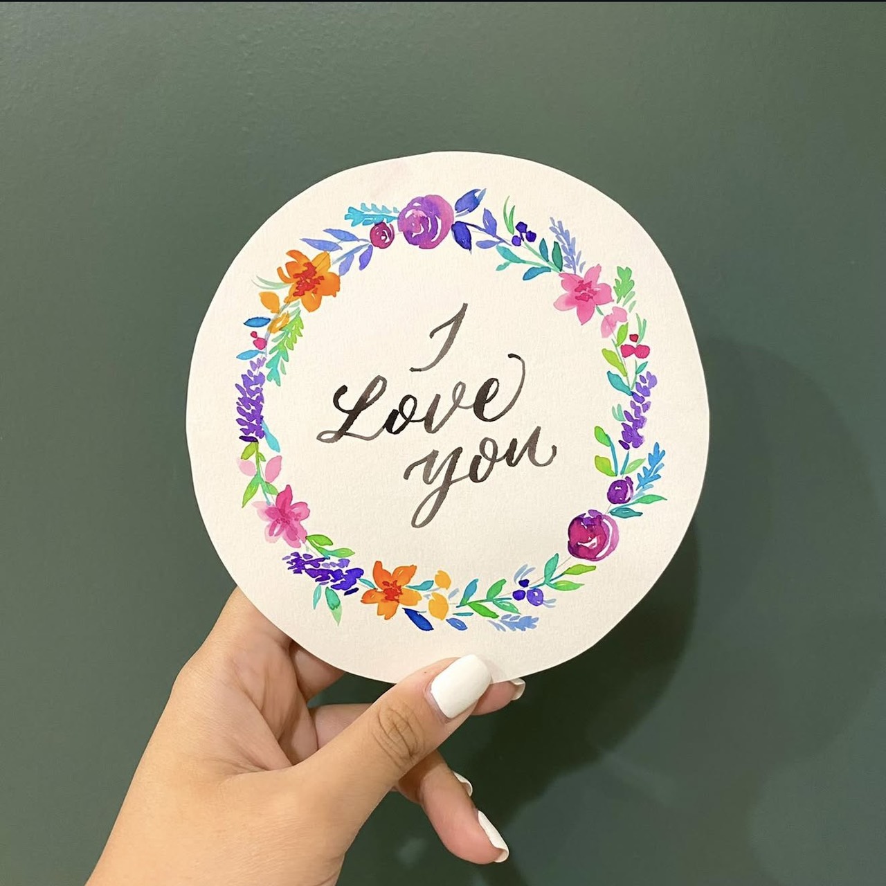 Watercolour wreath with calligraphy — the piece that became Ploy's most valued work