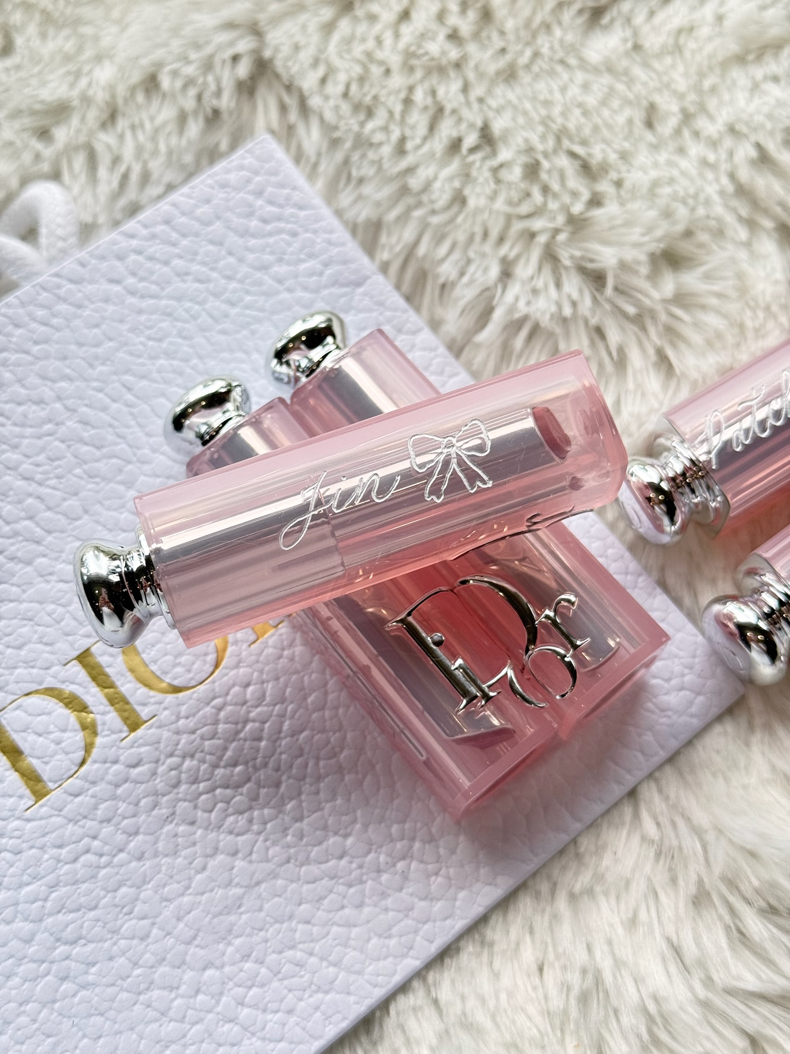 Dior Addict Lip Glow tube with calligraphed name on Dior branded card