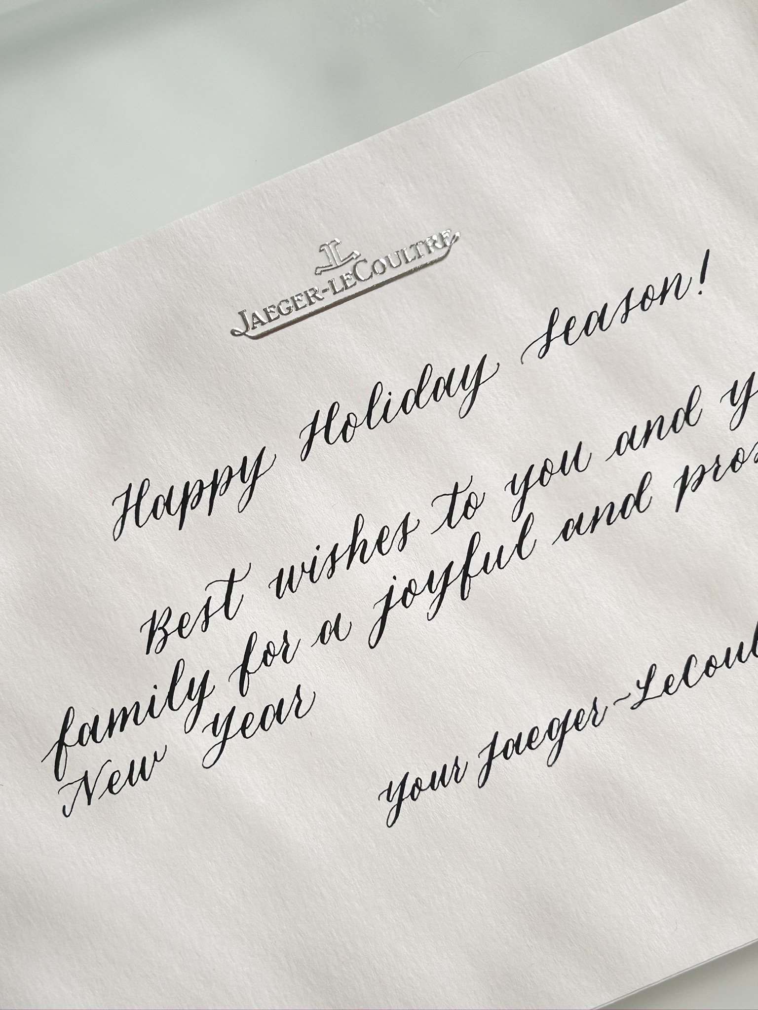 Calligraphy on Jaeger-LeCoultre branded Holiday Season card, ink on white textured stock